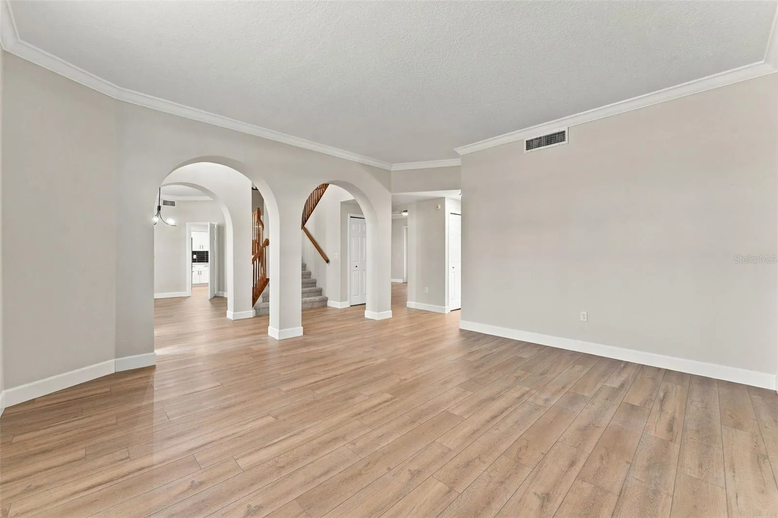 Formal living room is spacious and could serve multiple purposes