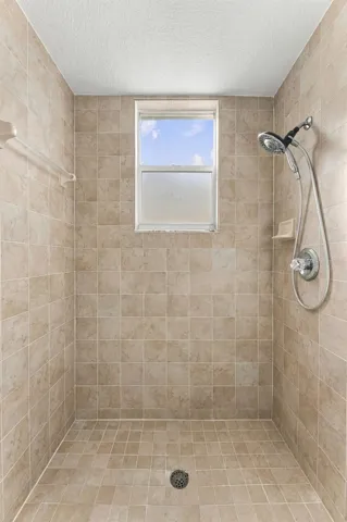 Large shower located in downstairs hall bathroom