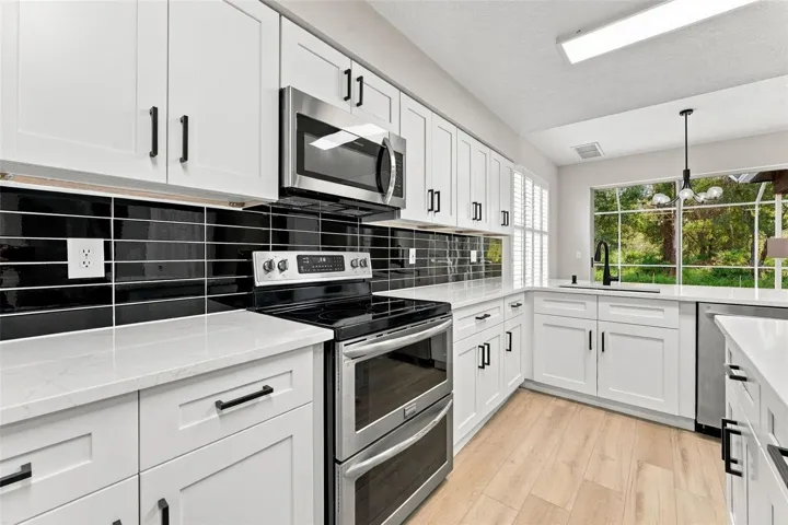 Very clean, modern look with the black subway tile backsplash