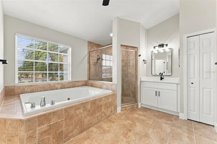 Large jacuzzi bathtub with separate shower stall