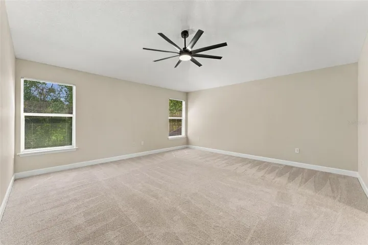 Primary bedroom is very spacious and tucked in the corner for your own private retreat