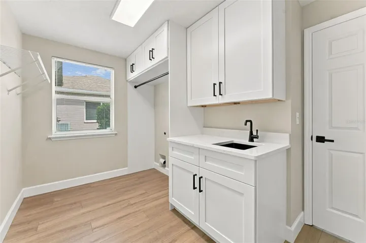 New cabinets. countertops and storage designed into your brand new laundry room