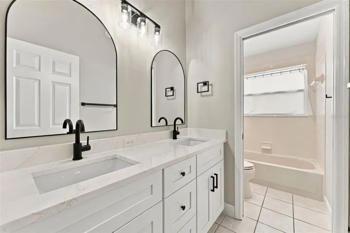 Hall bathroom upstairs with new dual vanity, lighting, mirrors &amp; fixtures