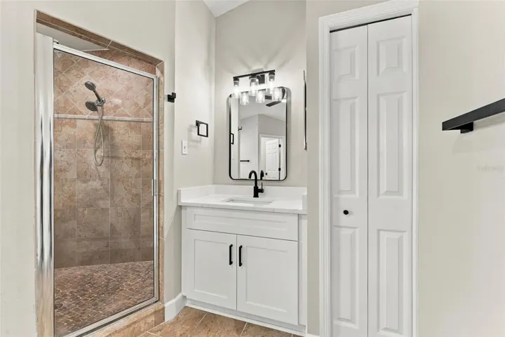 Linen closet in primary bathroom for additional storage