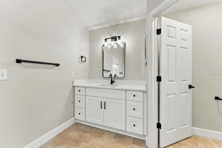 All new fixtures, finishes &amp; vanities in this primary bathroom