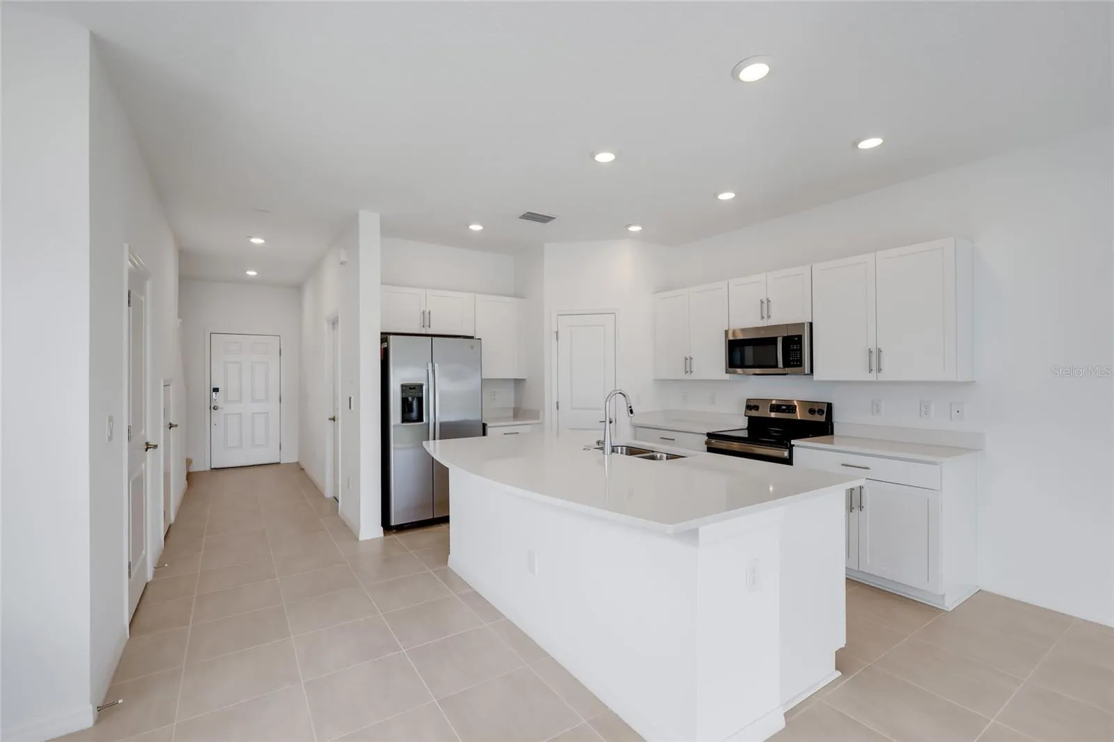 The large kitchen island provides a perfect area for entertaining as well as additional seating for family members for quick meals!