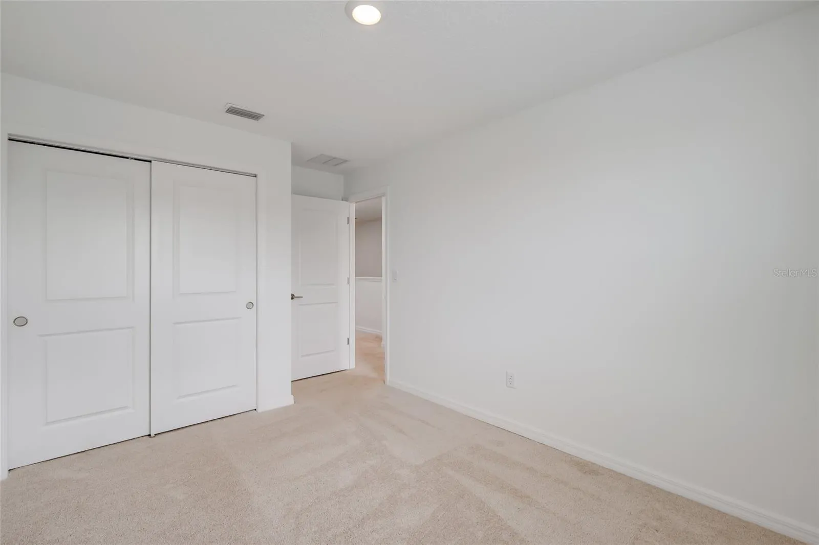 The large second bedroom provides plenty of space for children and/or guests and has a large closet and easy access to the hall bathroom!