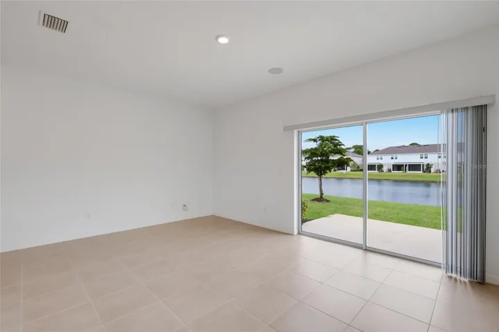 As an end unit, the family room (and corresponding upstairs master bedroom) extend nearly 3 feet more than interior units providing amazing living space! The lake views from the living room are spectacular!