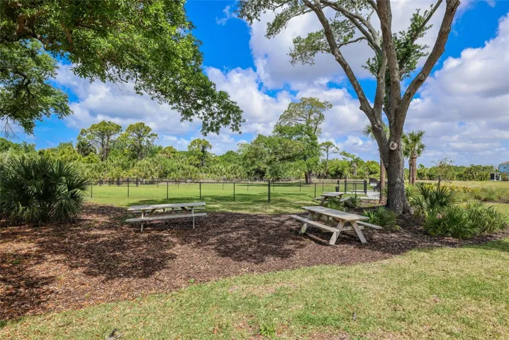 A picnic area is located just outside of the dog park to enjoy a nice outdoor family barbeque!