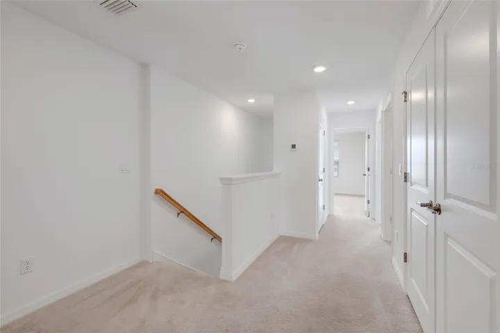 At the other end of the loft is the entrance to the other two bedrooms as well as the hall bathroom. Again, there is even more space for a small bench or another small work station area!