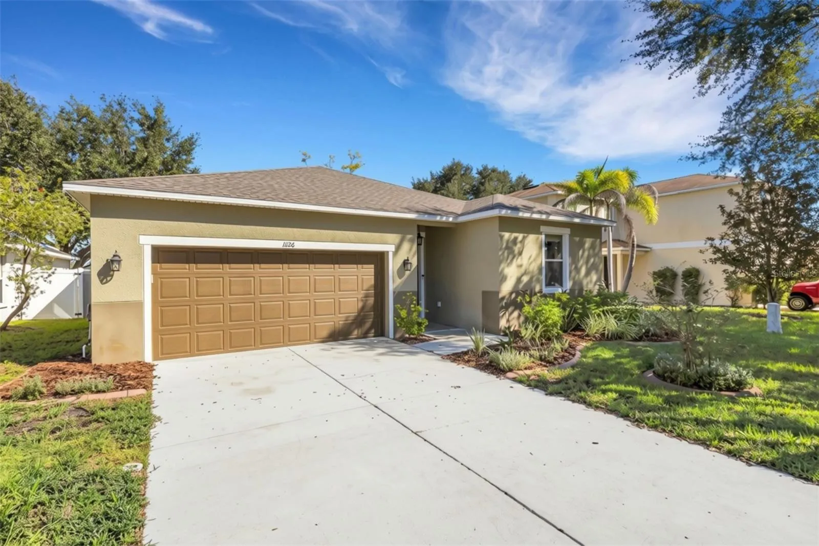 Front Elevation with Oversized Two Car Garage with Overhead Storage