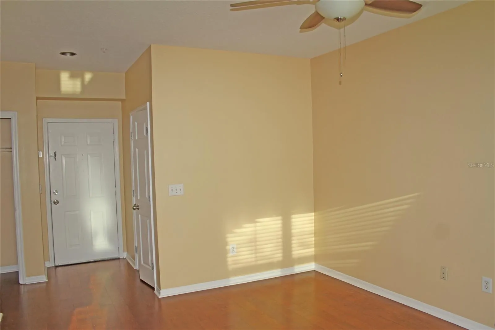 Living Room looking to Front Door and Office to the Right Side.