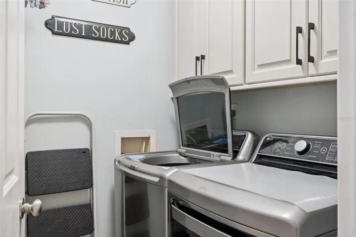 Washer and dryer at end of hallway