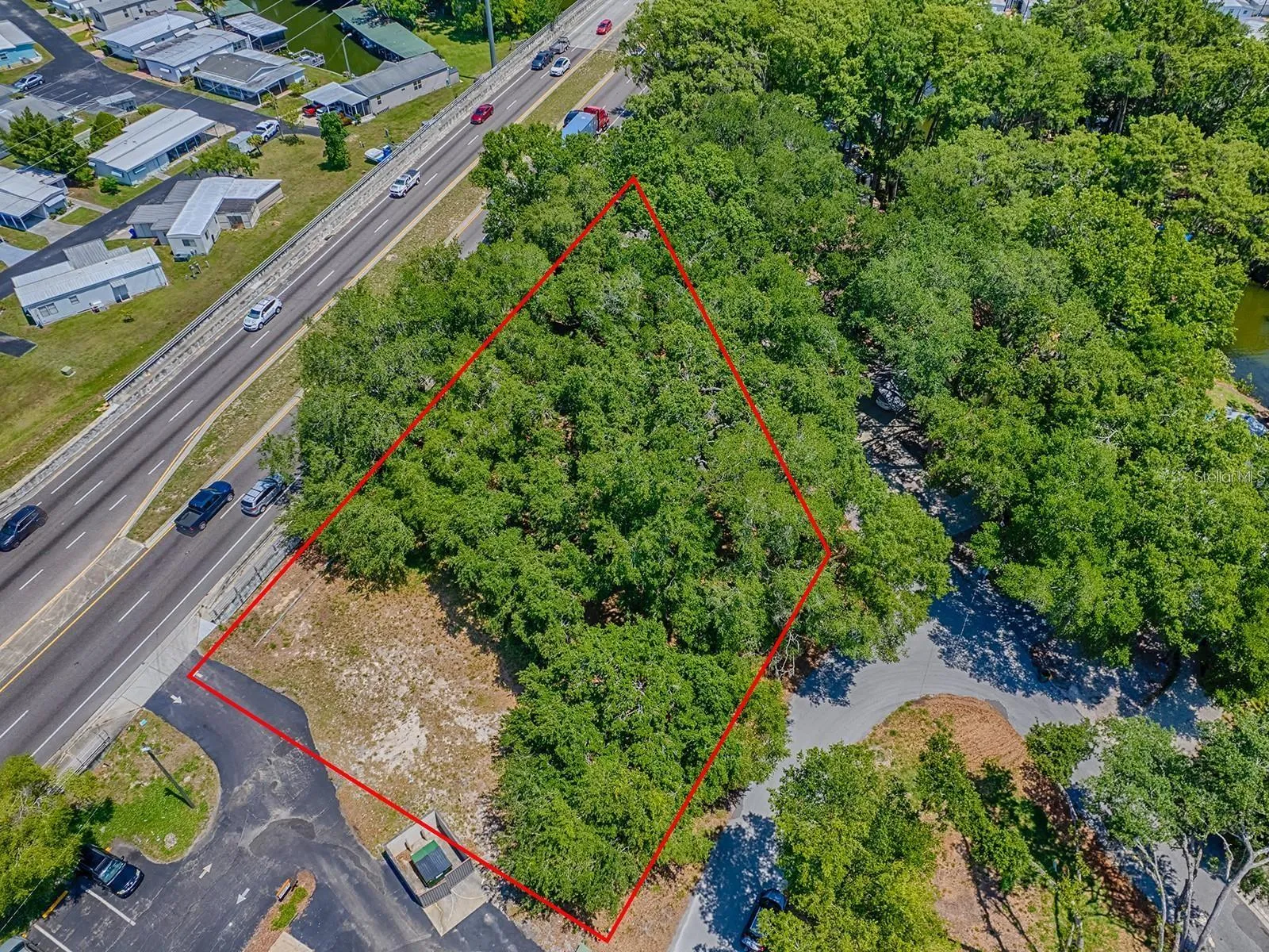 Aerial view of Lion Lane 0.59 acre of vacant land prominently situated along the heavily traveled, 4 lane divided highway State Road 19.