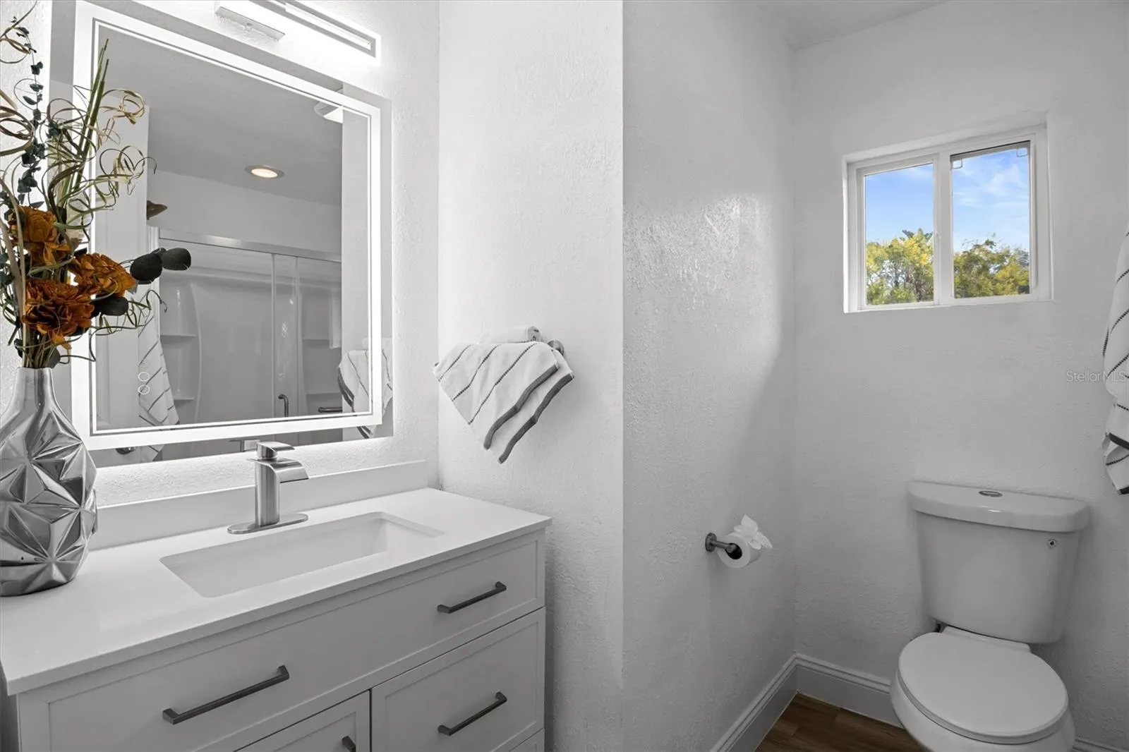 Primary Bathroom - Stone Countertops &amp; Lighted Mirror