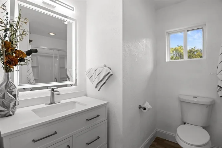 Primary Bathroom - Stone Countertops &amp; Lighted Mirror
