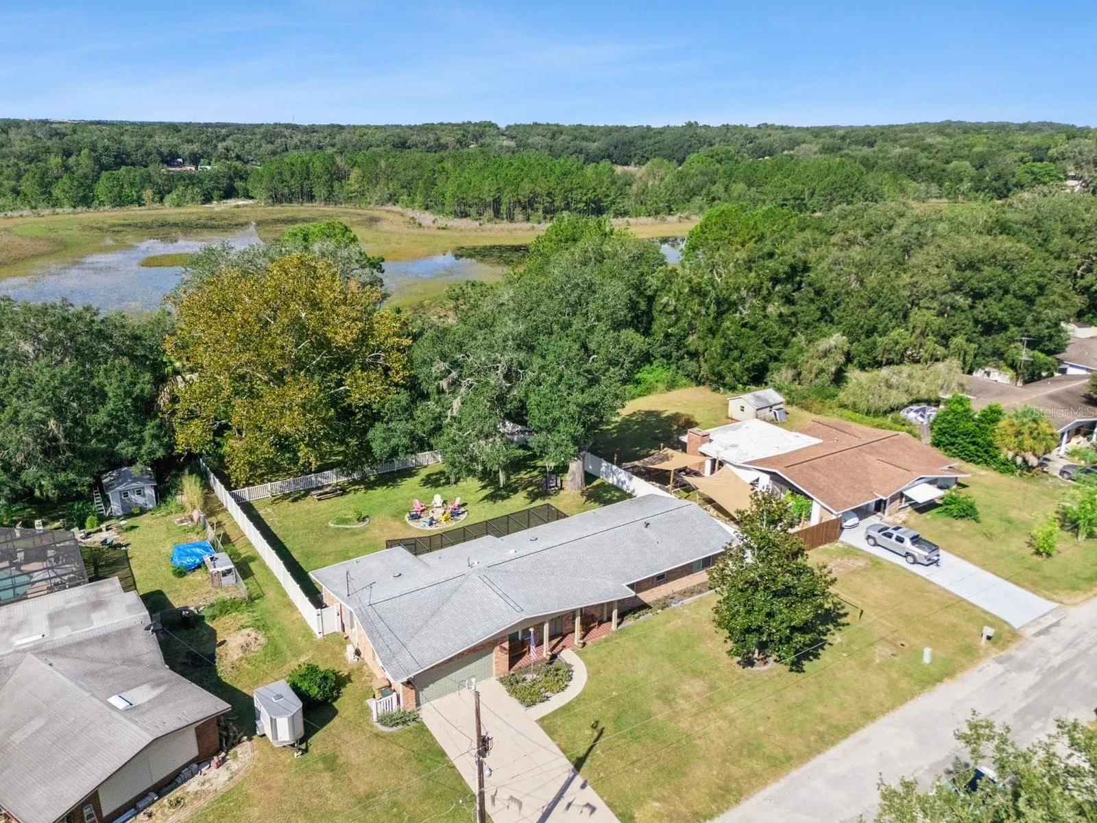 Aerial of backyard toward Spring Lake