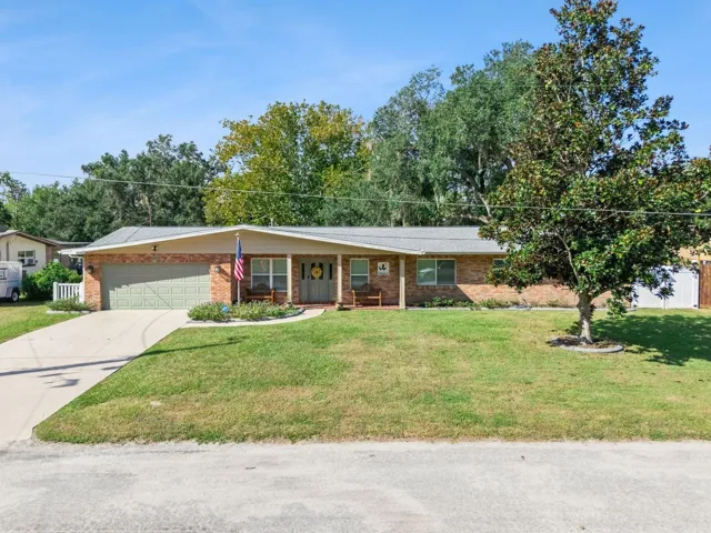 Front exterior with landscaped yard