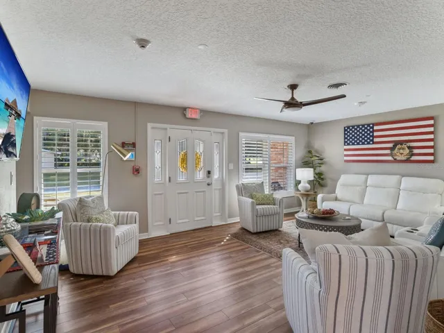 Living room with plantation shutters and LVP flooring