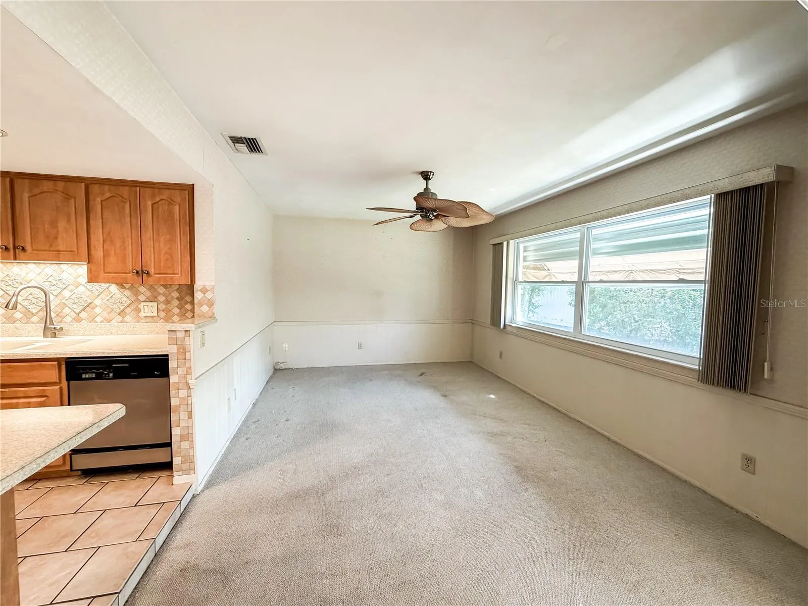 The family room is immediately off the kitchen and also has sliding glass doors to the lanai.