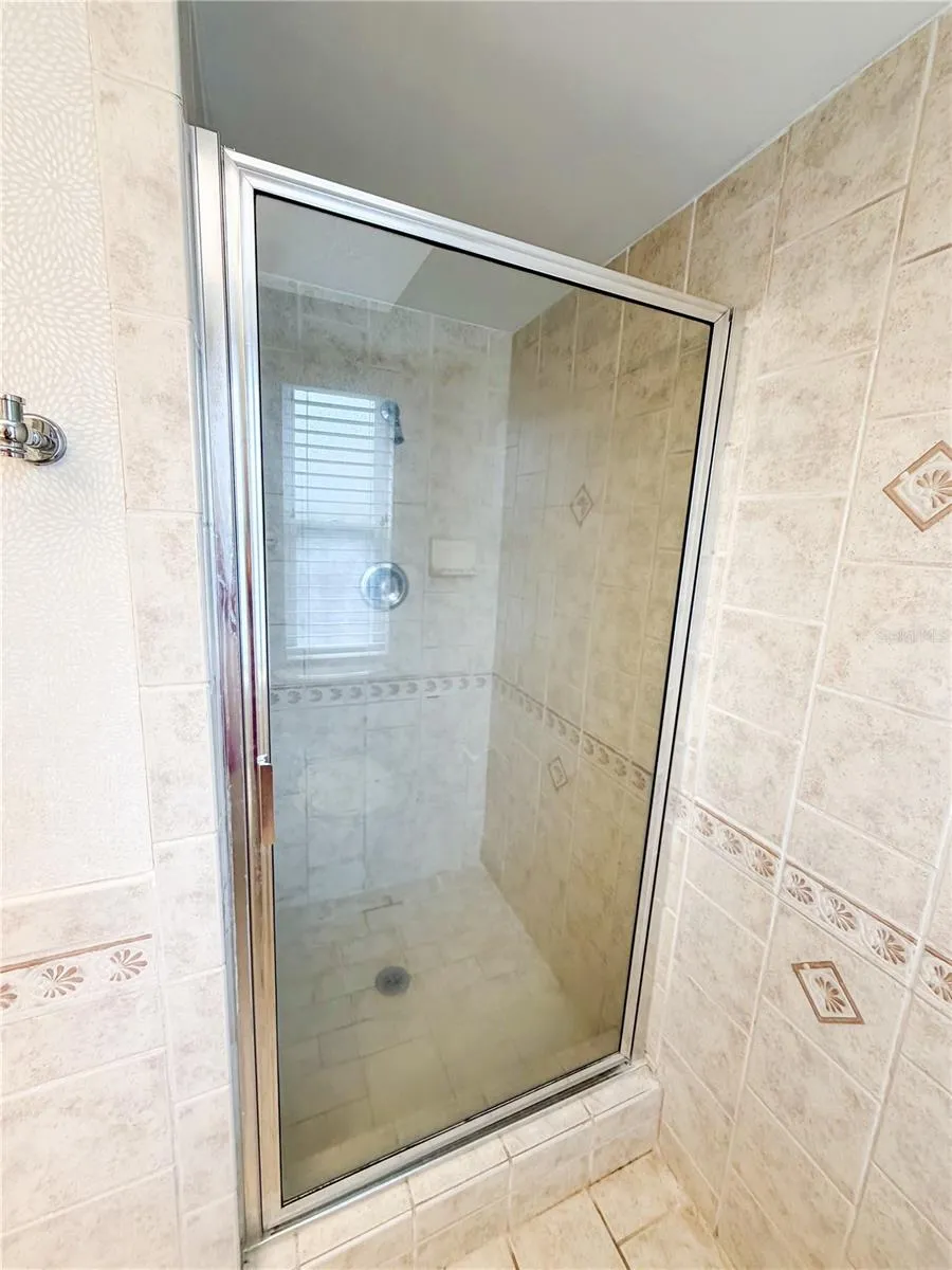 The primary ensuite offers a walk in shower.