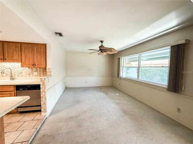 The family room is immediately off the kitchen and also has sliding glass doors to the lanai.