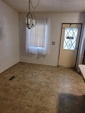 Dining room showing entry door from screen room.