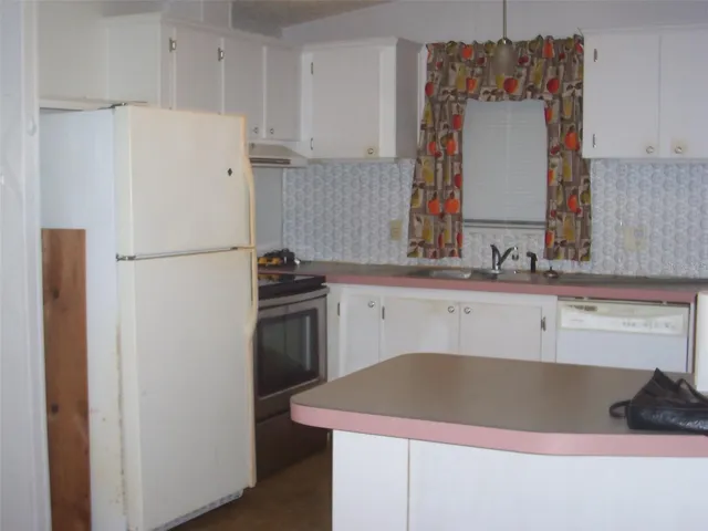 Complete kitchen showing the serving window to the great room.  Convenient for entertaining.