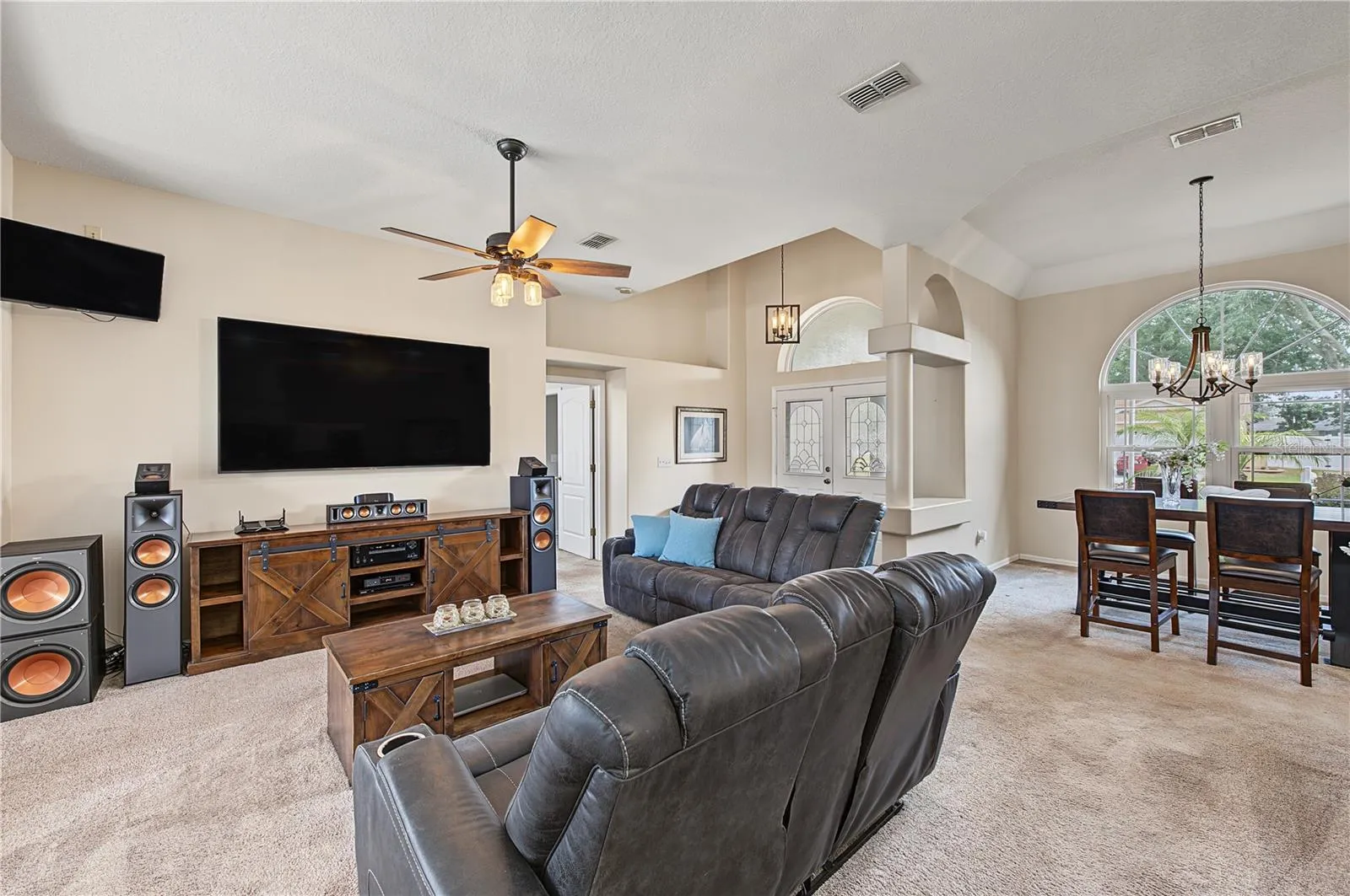 Large open great room, vaulted ceilings, Ceiling fan with lights.