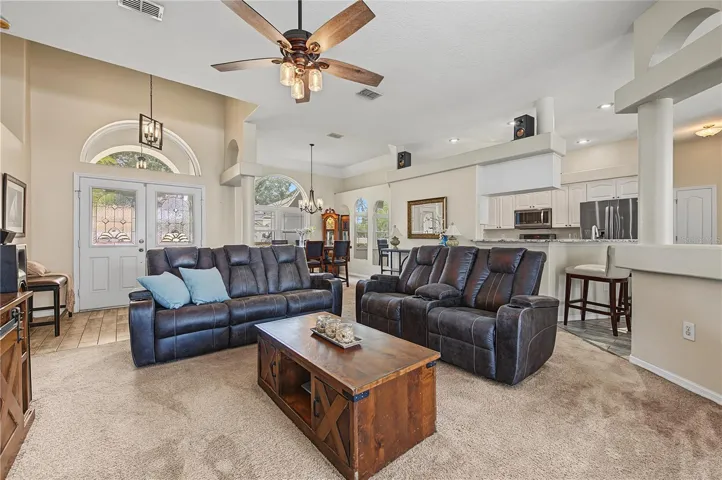 Large open great room, vaulted ceilings, Ceiling fan with lights.