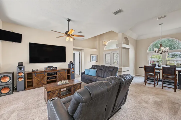 Large open great room, vaulted ceilings, Ceiling fan with lights.