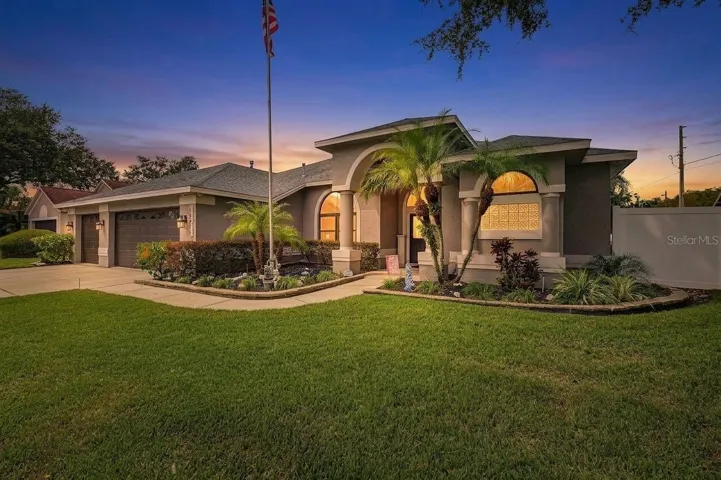 Front Exterior- 3 bedrooms/2 bathrooms/3 car garage/pool/corner lot that is fenced in!!
