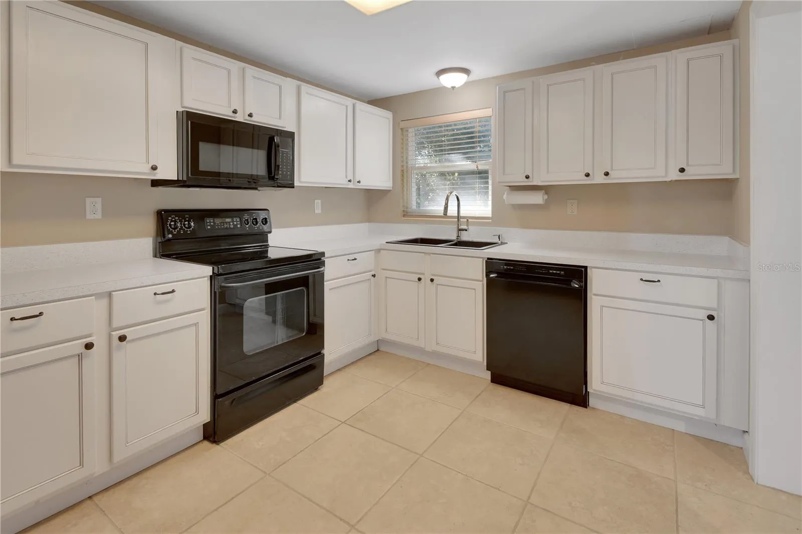 Sweet kitchen with new countertops, dishwasher and microwave.