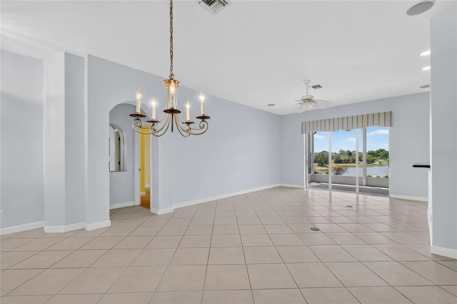 The Open Concept Floor Plan, with dining room, living room and kitchen allows views of the lake from all the rooms.