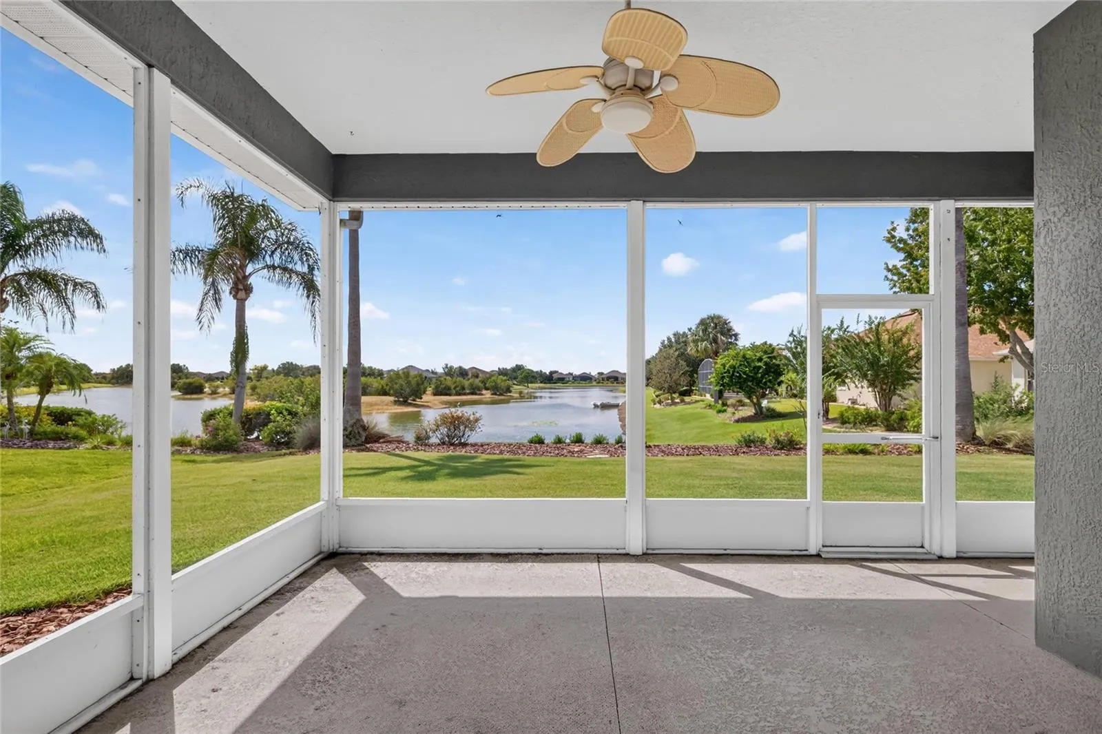 The screen lanai is a great place to catch a breeze off the lake, relax or entertain.
