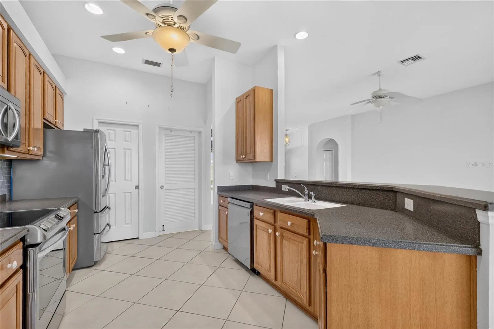 The laundry and pantry are located at the end of the kitchen.