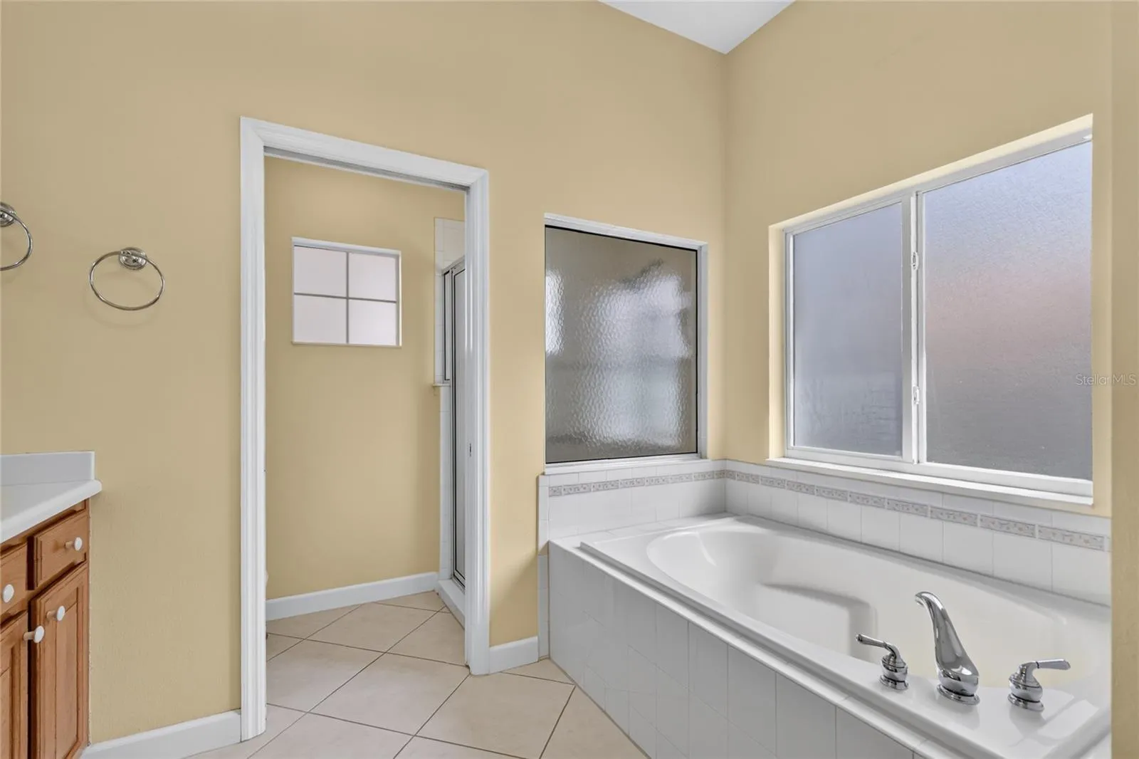 Frosted windows in tub and shower areas allow light while keeping your privacy.