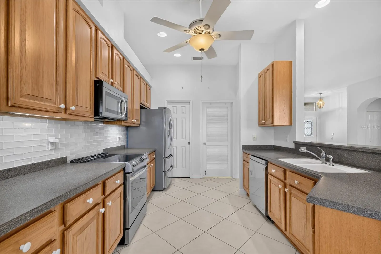 The updated appliances and spacious countertops make this kitchen a great place to cook or bake.  A walk in pantry is a great addition to this kitchen.