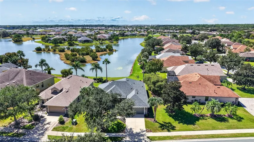 Arial photo of 7887 Crosswinds Way with lake in background.