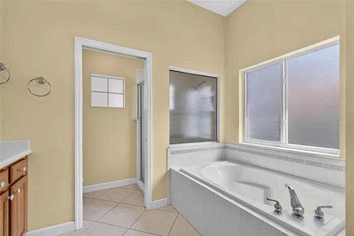 Frosted windows in tub and shower areas allow light while keeping your privacy.