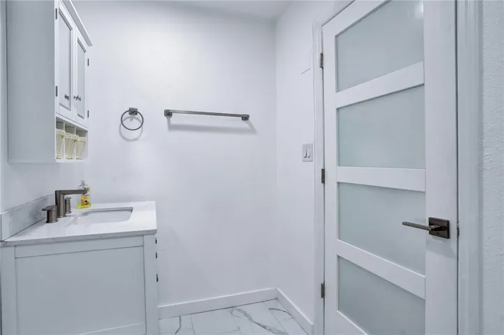 Fully renovated primary bathroom with new door