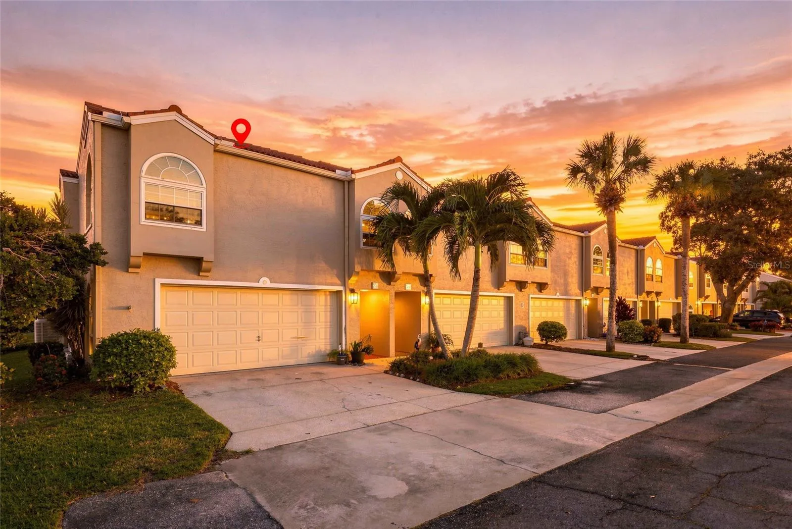 Beautiful twilight view showcasing the home’s desirable corner setting and inviting exterior.