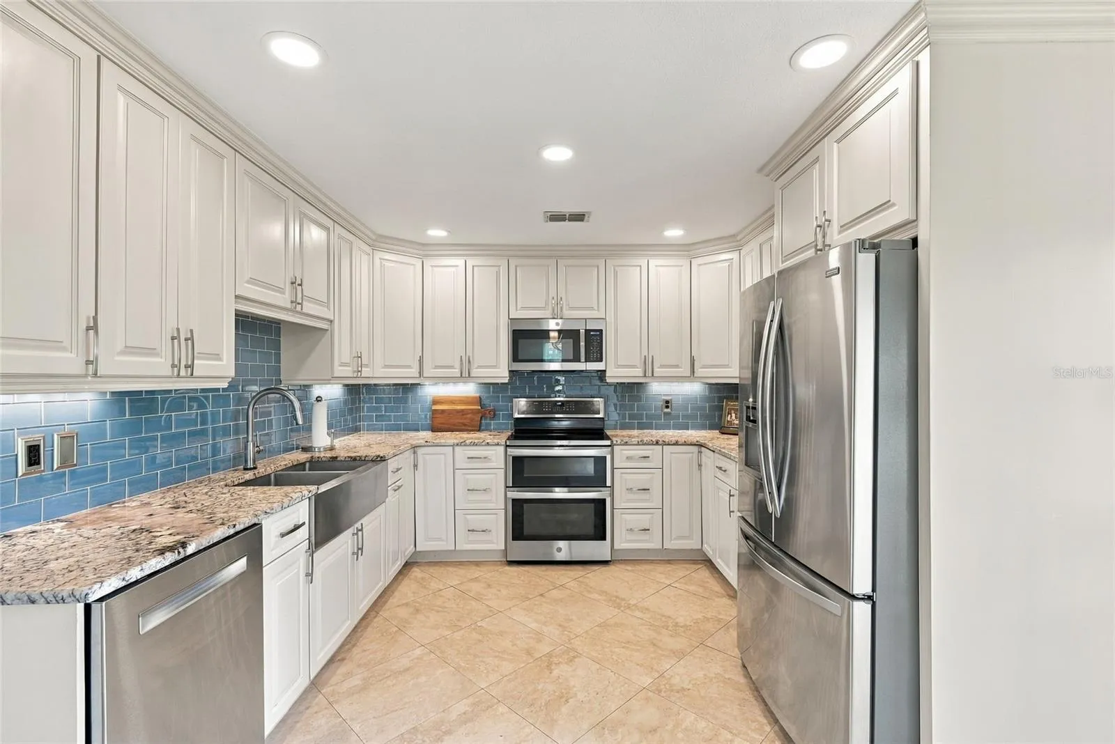 Quality finishes include a Kraus sink, California Faucets fixtures, and stainless steel appliances.