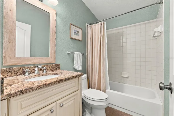 updated upstairs guest full bathroom with shower tub combo.