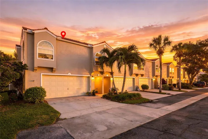 Beautiful twilight view showcasing the home’s desirable corner setting and inviting exterior.