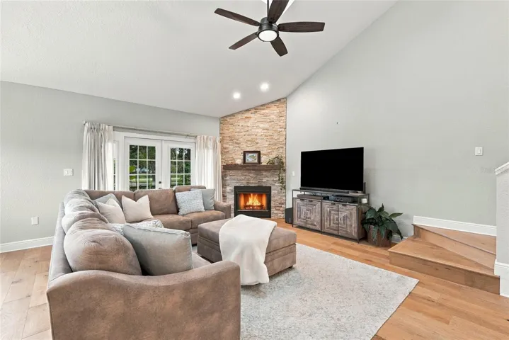 Soaring double-height vaulted ceilings create an impressive sense of space and openness.