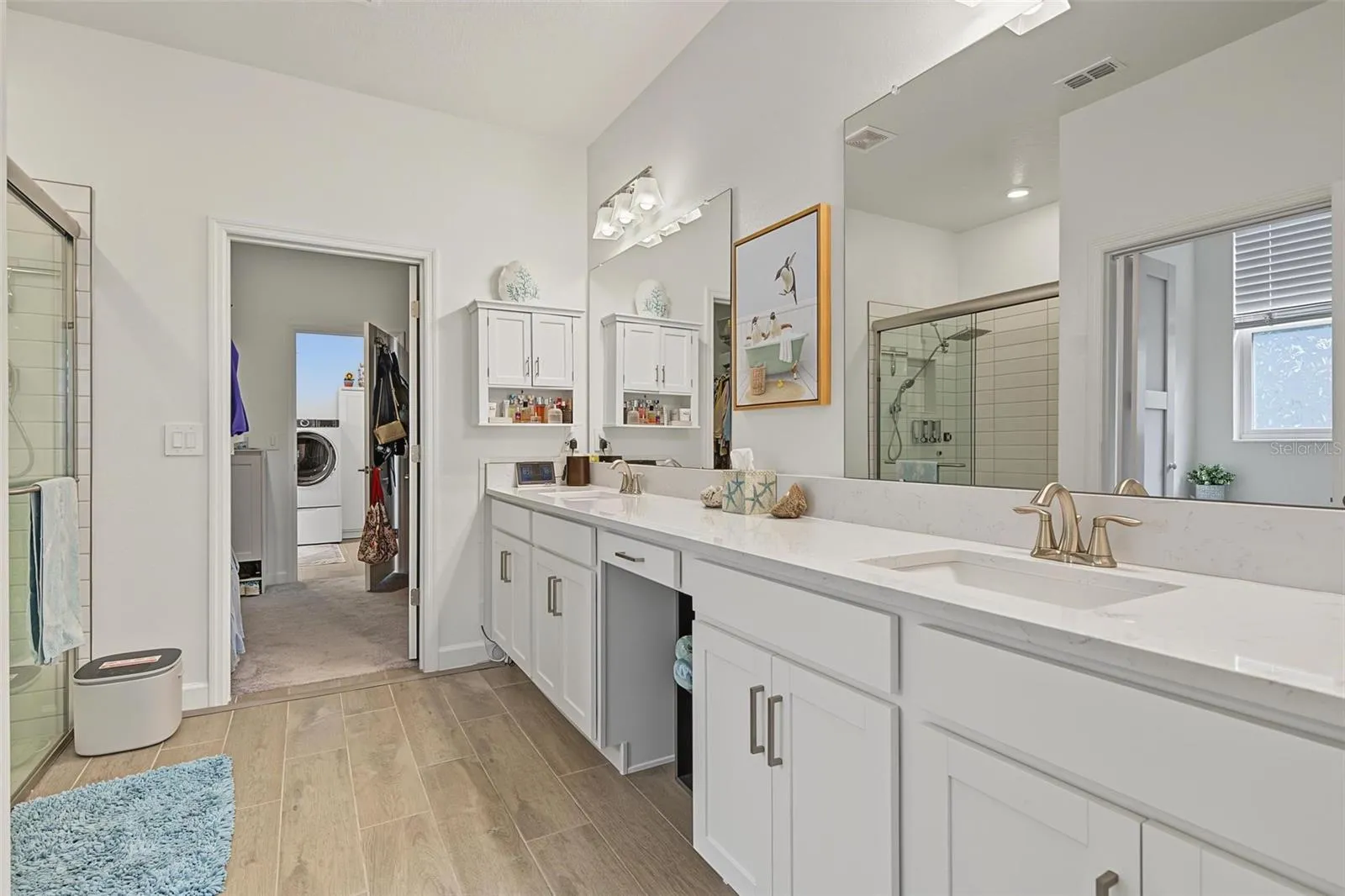 So convienent! Bath opens to closet & laundry room