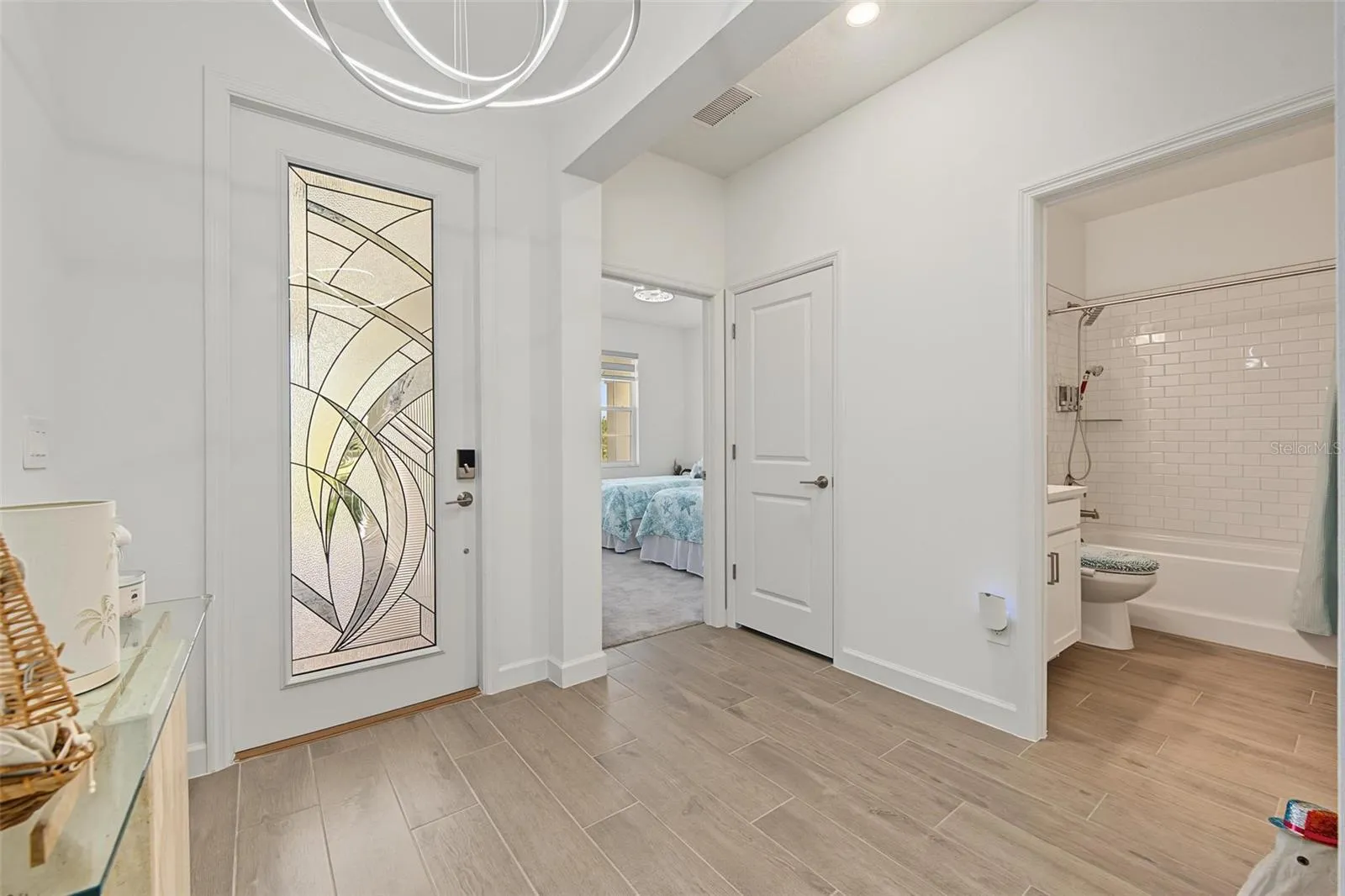 Entry w/full glass door & upgraded lighting