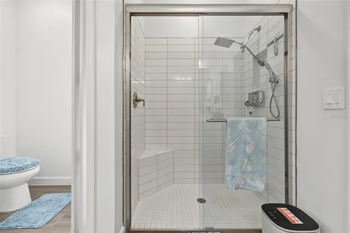 water closet w/sliding door & large shower