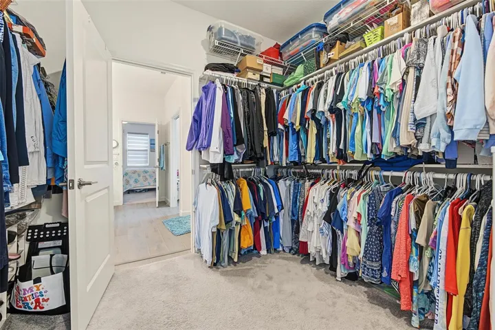owners closet opens to laundry room and owners bath